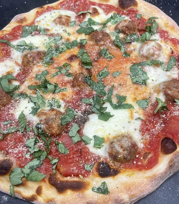Meatball pizza with homemade meatballs, mozzarella and fresh basil