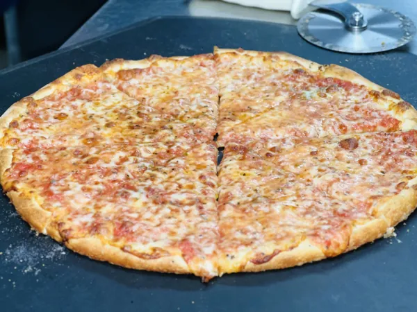 New York style cheese pie cut into slices
